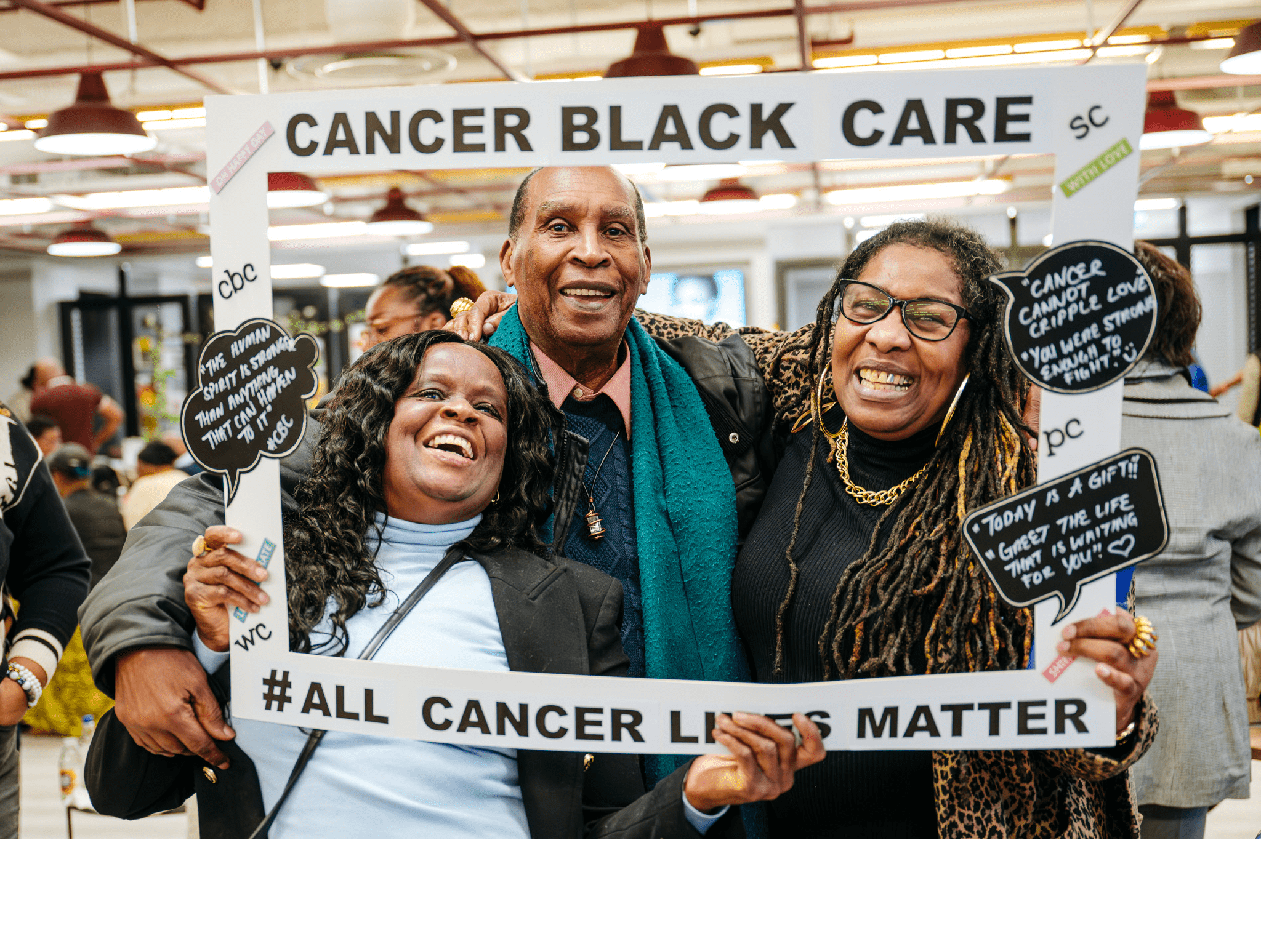 Three people holding All Cancer Lives Matter sign